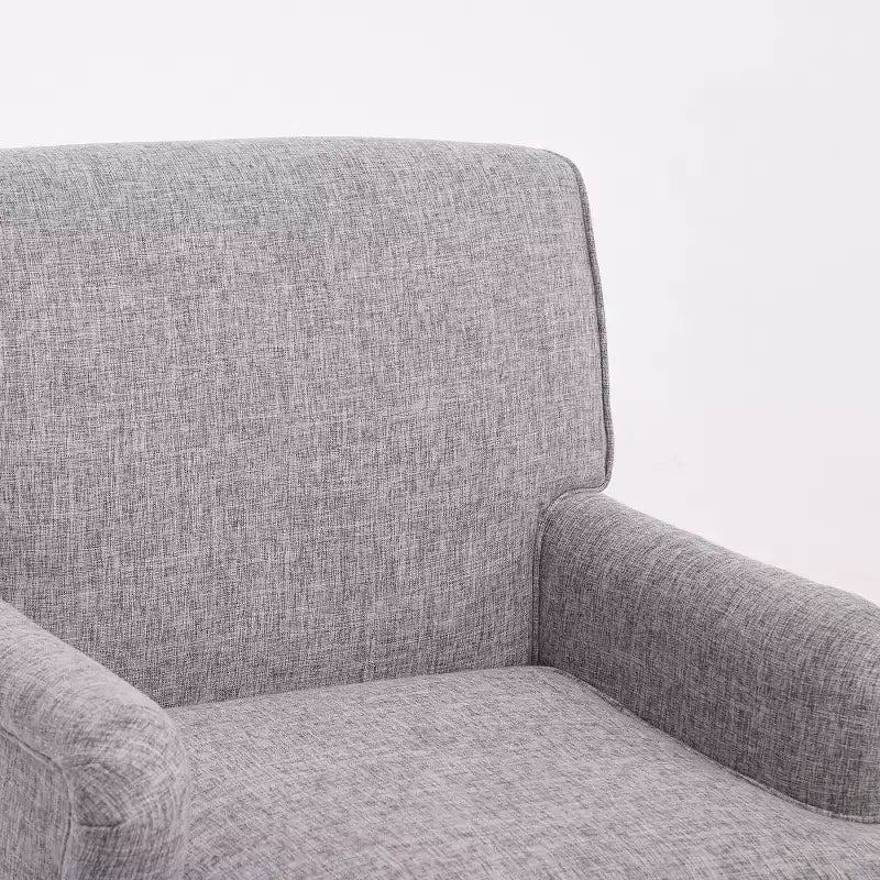 Fauteuil vintage en lin avec accoudoirs tapissés et pieds en bois massif ancien
