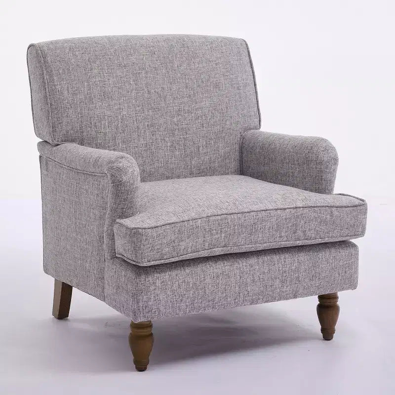 Fauteuil vintage en lin avec accoudoirs tapissés et pieds en bois massif ancien