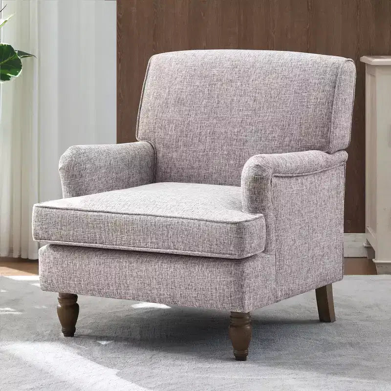 Fauteuil vintage en lin avec accoudoirs tapissés et pieds en bois massif ancien