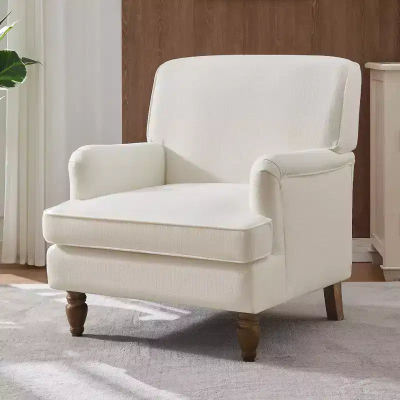 Fauteuil vintage en lin avec accoudoirs tapissés et pieds en bois massif ancien